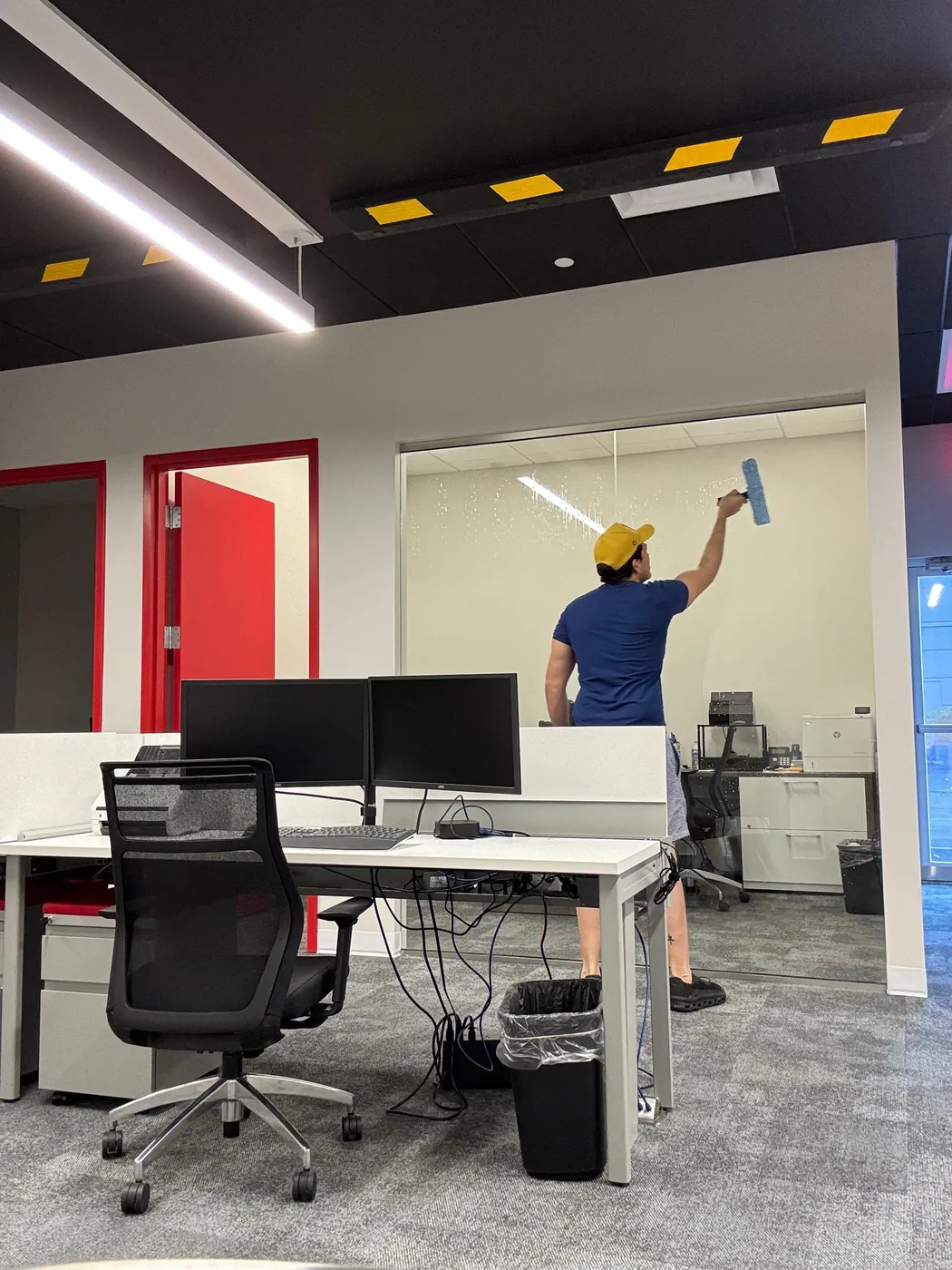 Solutionicers team member cleaning a commercial office